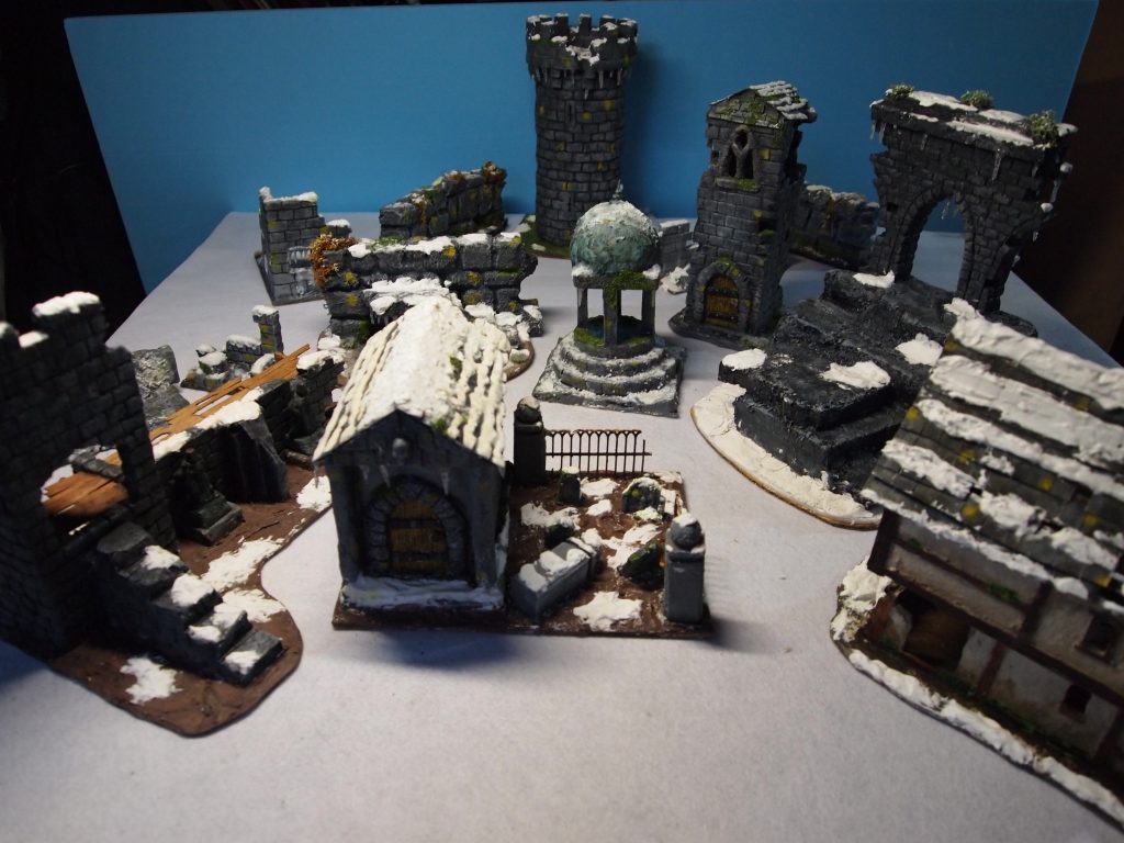 Model ruined buildings dusted with snow for Frostgrave skirmish wargame