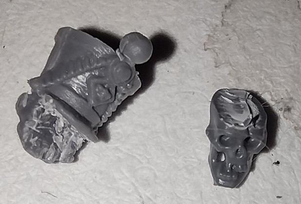 miniature french infantry head and citadel skull cut to fit together