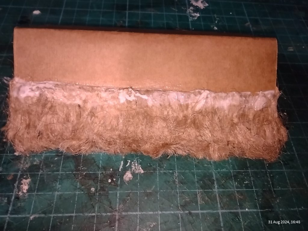 two layers of thatch added to model roof