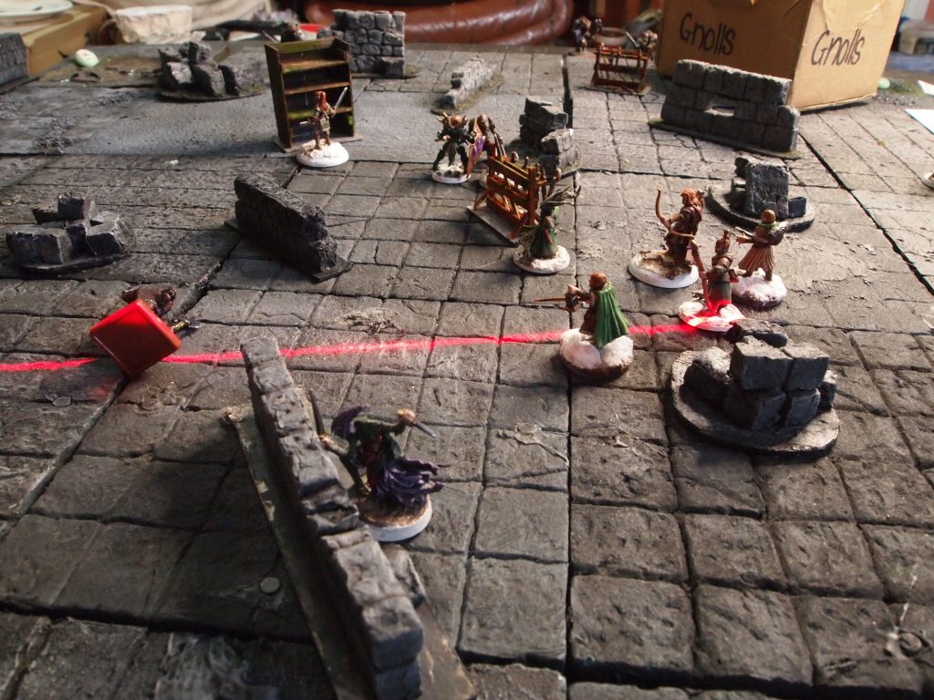 Miniatures on a a wargames board for the Frostgrave skirmish wargame