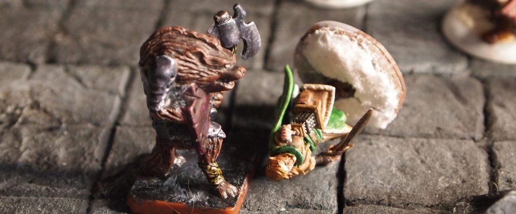 Miniatures on a a wargames board for the Frostgrave skirmish wargame