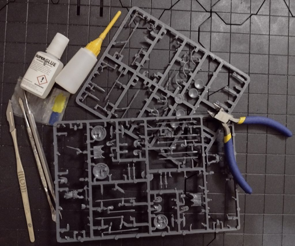 Plastic miniature sprues, modelling tools and glues