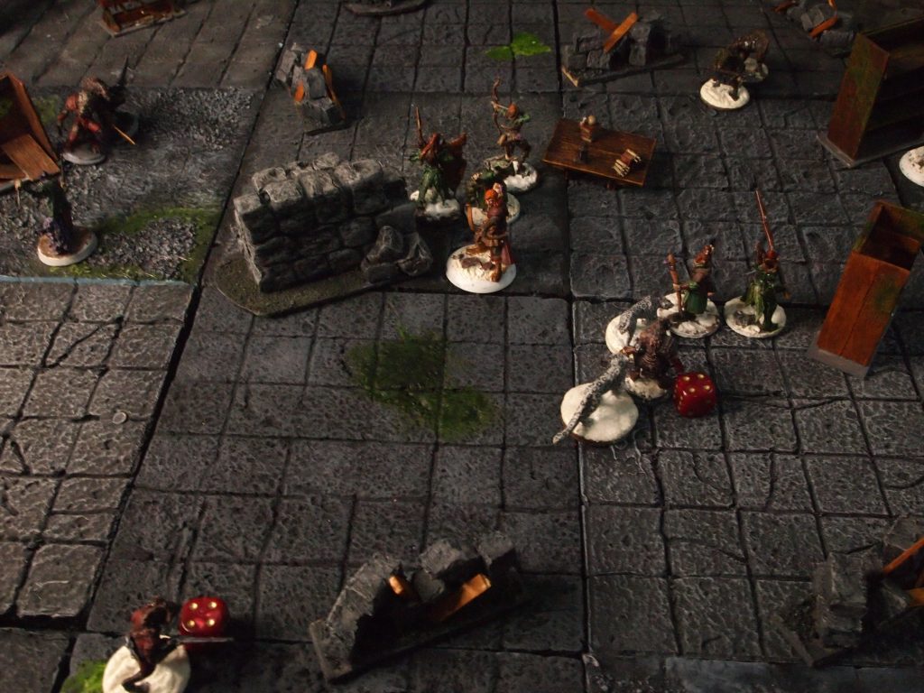 Miniatures on a wargames table for the Frostgrave skirmish wargame