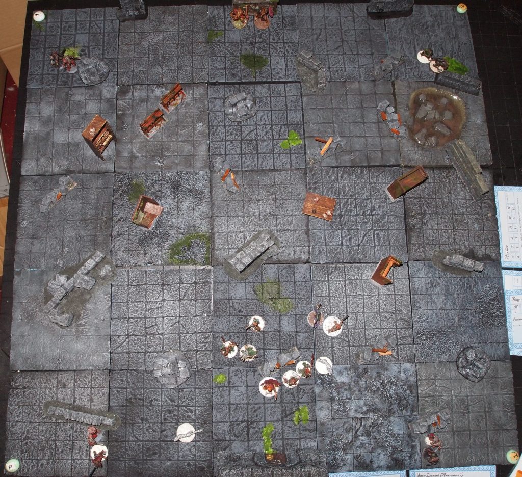 Wargame board set up with miniatures