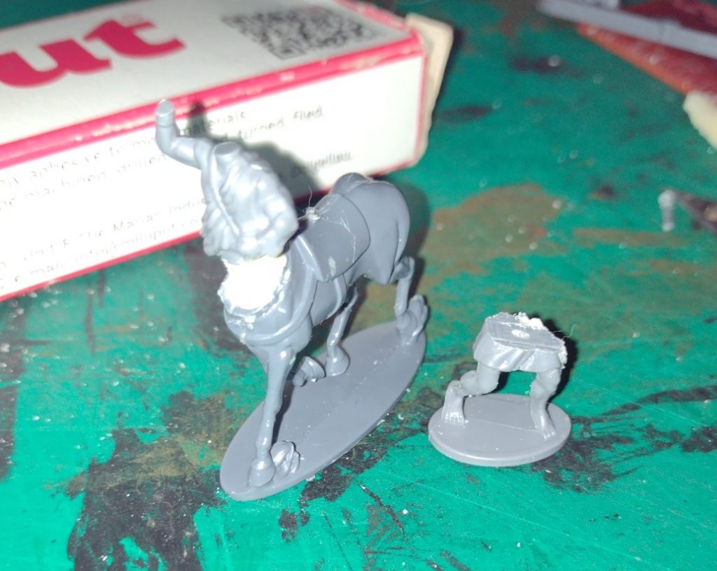 The gap between the horse body and javelin man body is filled with milliput two part epoxy putty.