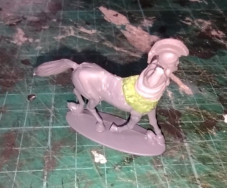 The re=built centaur miniature with lower tunic sculpted with a mix of greenstuff and milliput epoxy putties.