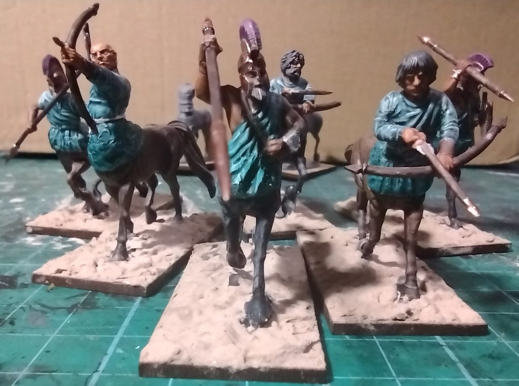 Six kitbashed centaur miniatures.