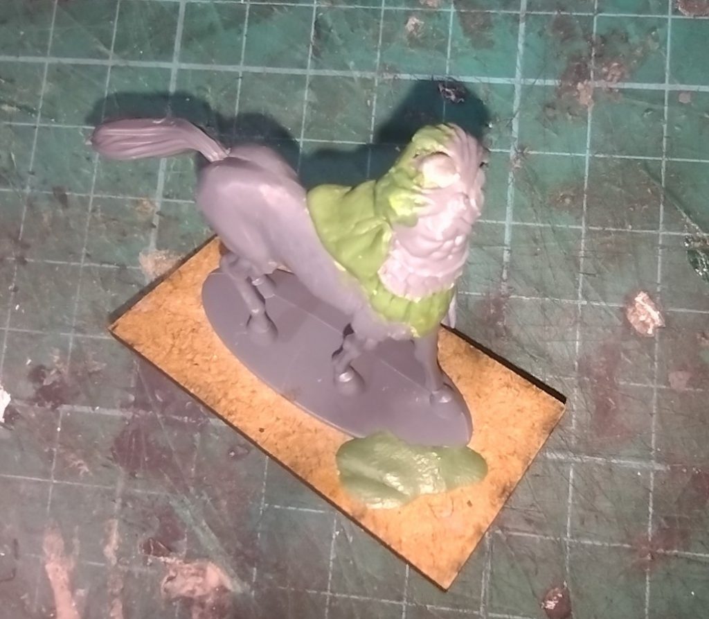 Kit-bashed centaur miniature with a greenstuff cloak added.