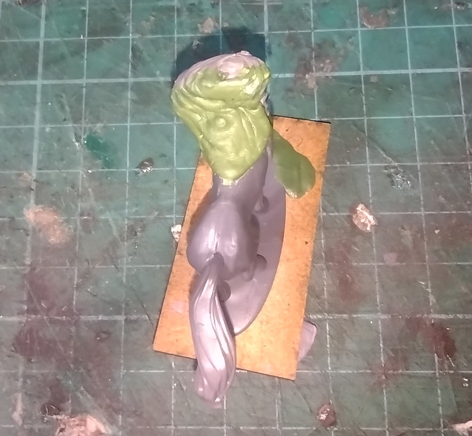 Another view of the kit-bashed centaur miniature with a greenstuff cloak added.