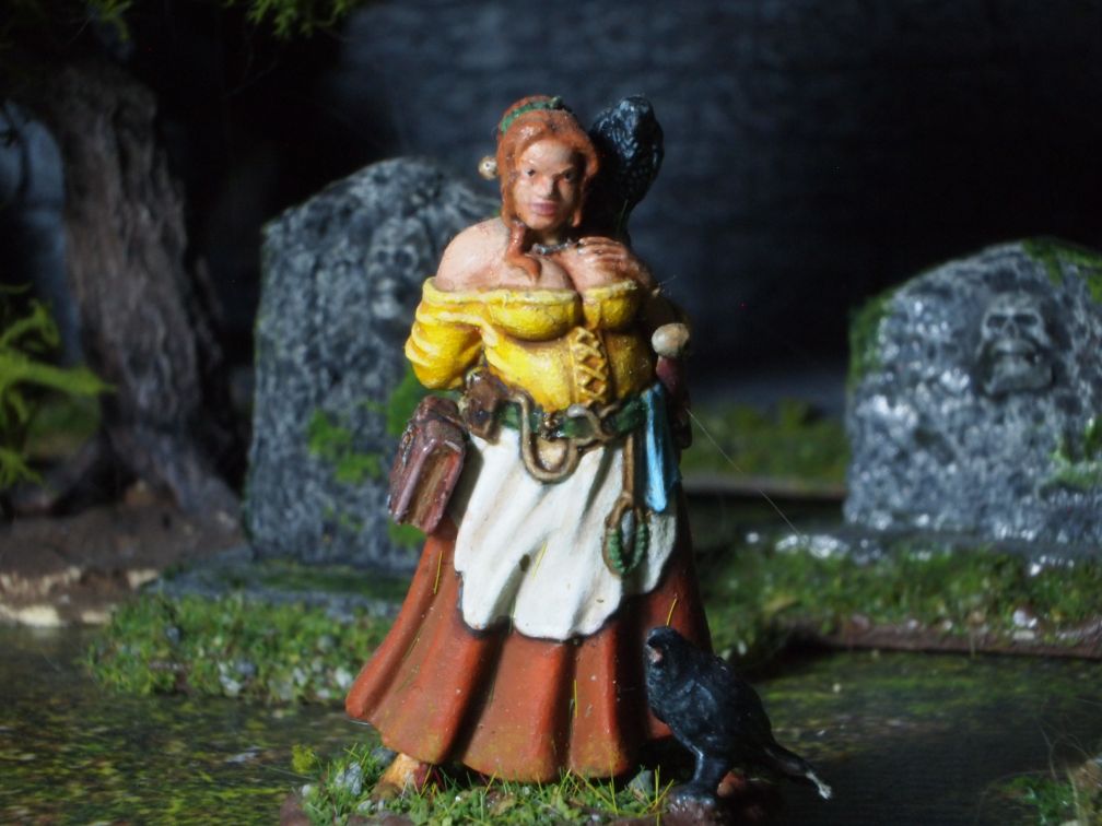 28mm miniature village wise woman with crow familiars.